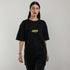 schwarzes oversized "Techno Tribe Circle" Raver T-Shirt von vorne, getragen von einer Frau